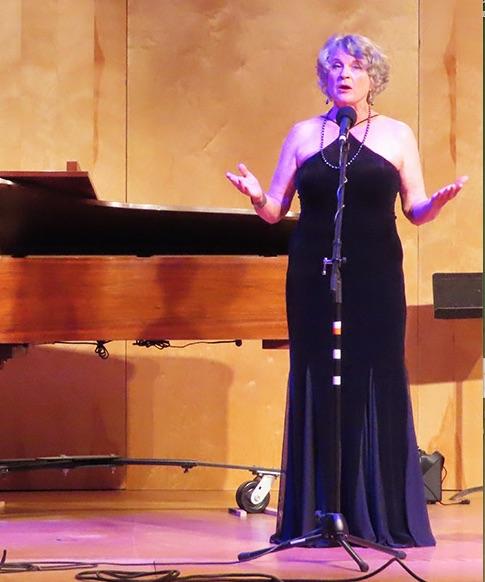 Andrea black gown onstage